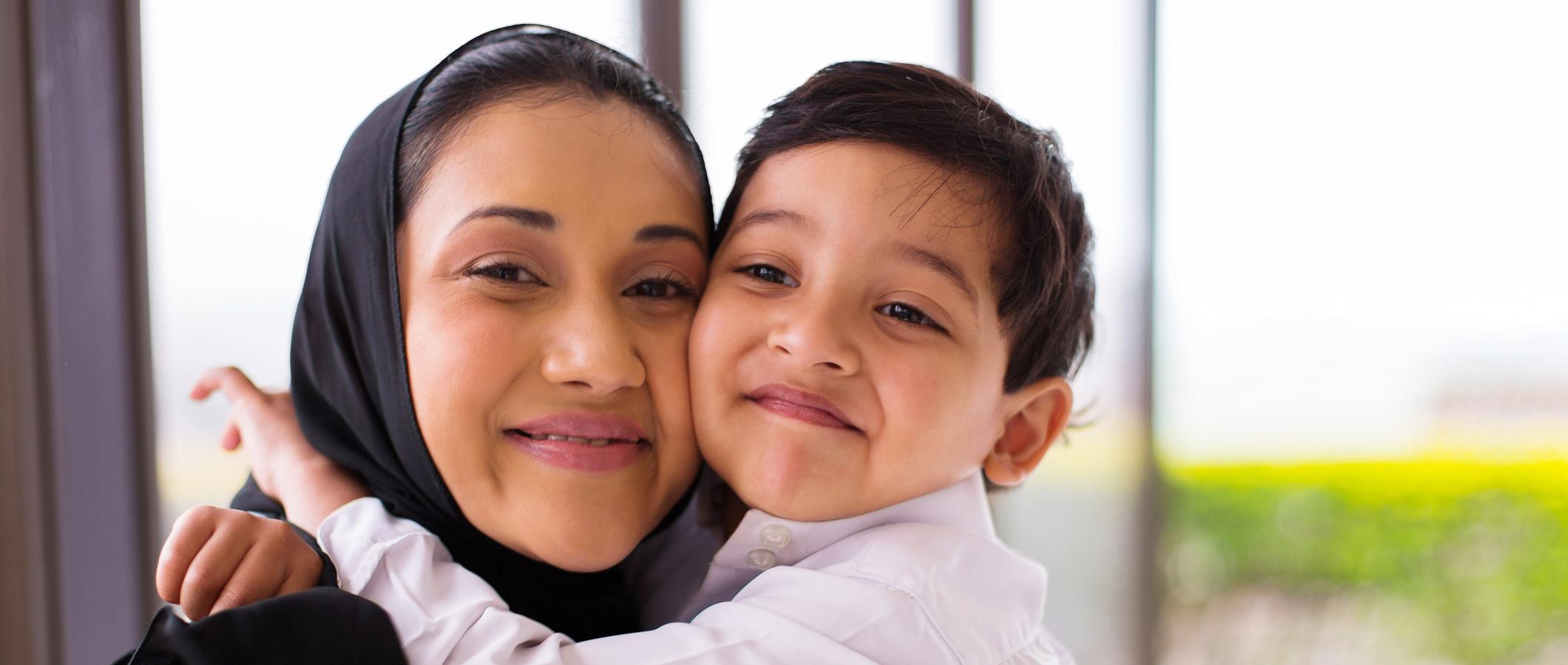 Muslim family waving